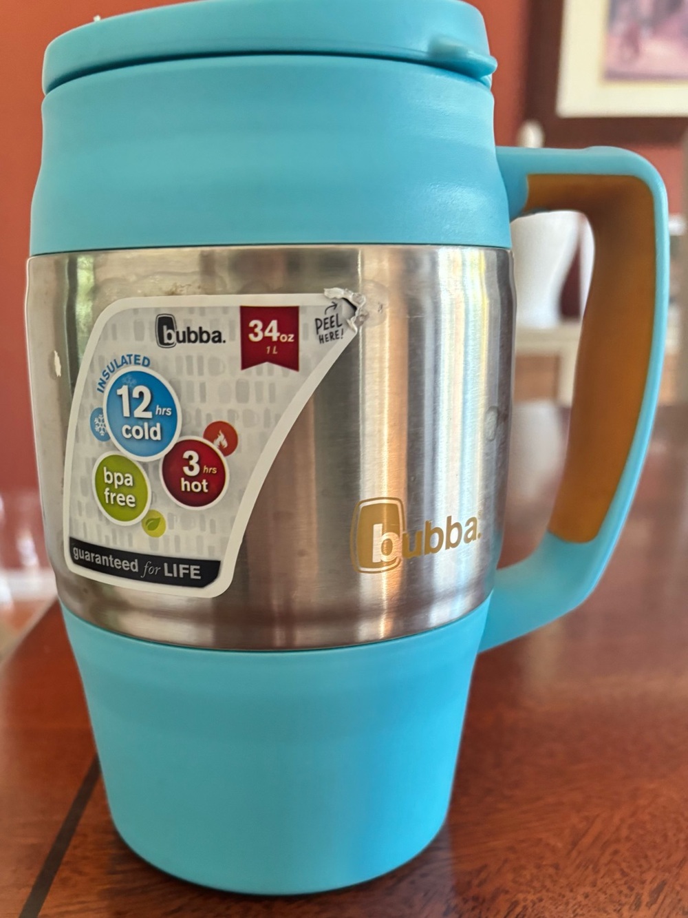 Bubba 34 oz blue insulated stainless steel mug with orange lid